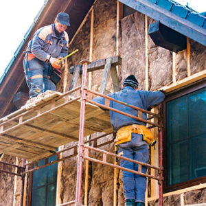 construction workers insulating house