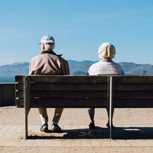 old couple sitting on bench